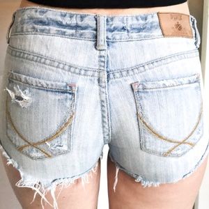 light wash distressed denim shorts